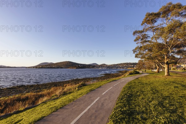 Clarence Foreshore and walking trail on a clear spring evening crossing the Derwent RIver in central Hobart, Tasmania, Australia