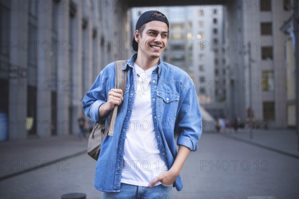 Background on the street while waiting his colleagues. Businessman wearing casual white shirt and spectacles. People