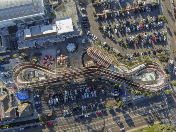 Aerial view of iconic Giant Dipper roller coaster in Belmont Park, an amusement park built in 1925 on the Mission Beach boardwalk, San Diego, California, USA. Old wood roller coaster July 13th, 2020