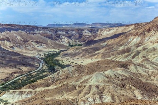 Wonderful spring in Israel. Gorge and desert canyon Ein Avdat. Beautiful warm windy day in the Negev desert. The concept of ecological, active and photo tourism