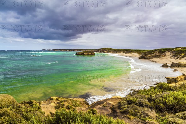 The Great Ocean Road of Australia. Picturesque seashore, coastal cliffs and sandy beaches of the Pacific. The concept of exotic, active and photo-tourism