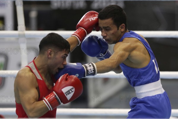 Sofia, Bulgaria. 27th February, 2021. Daniel Asenov (red) of Bulgaria and Deepak Komar of India fight in their final round of Fly (52kg) category of the 72-nd International Boxing Tournament Strandja 2021, Sofia, Bulgaria