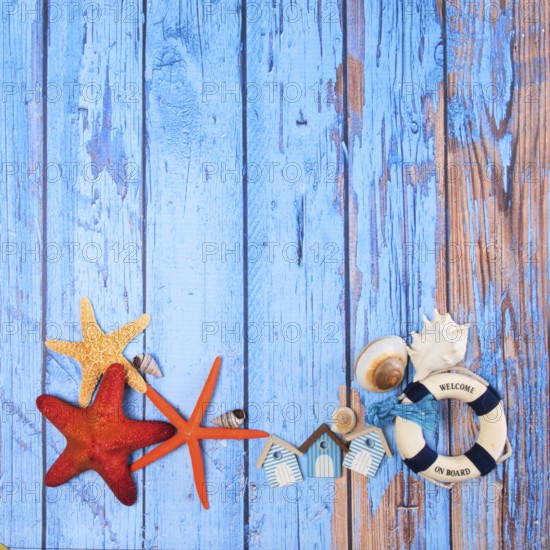Beach poster on wooden background with starfishes and cabins