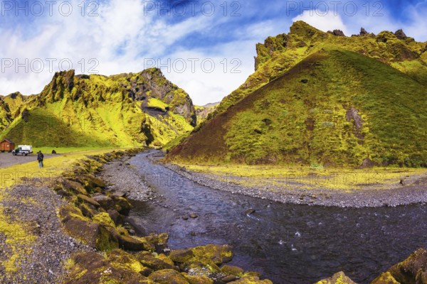 The photo was taken Fisheye lens. Camping in valley of canyon Pakgil. The canyon flowing fast shallow creek. Summer blooming Iceland