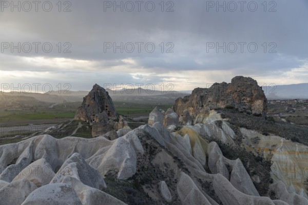 A picture of the Meskendir Valley, part of the Goreme Historical National Park, during a rainy sunset