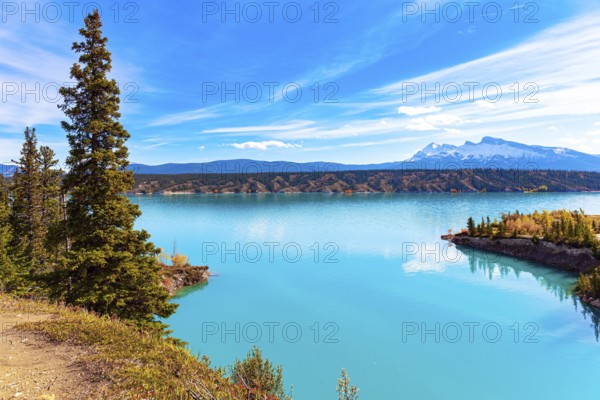 Picturesque Abraham Lake with blue water. Sunny day in October. Gorgeous Canadian autumn. Journey Magical Rocky Mountains