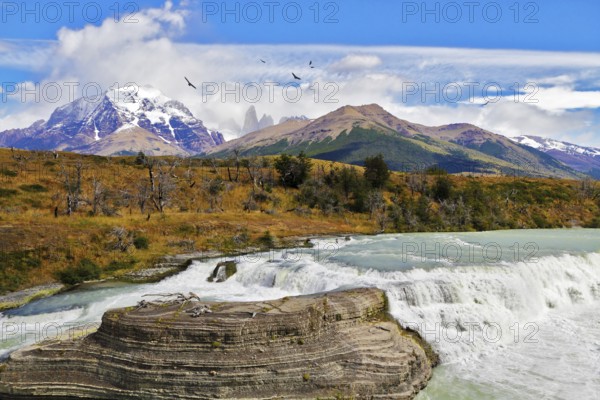 South of Chile. Scenic powerful and high-water waterfall Cascades Paine in the national park Torres del Paine