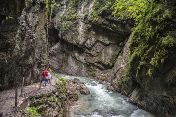 Hiking through the scenic Partnach gorge near Garmisch-Partenkirchen in the Bavarian Alps, Germany
