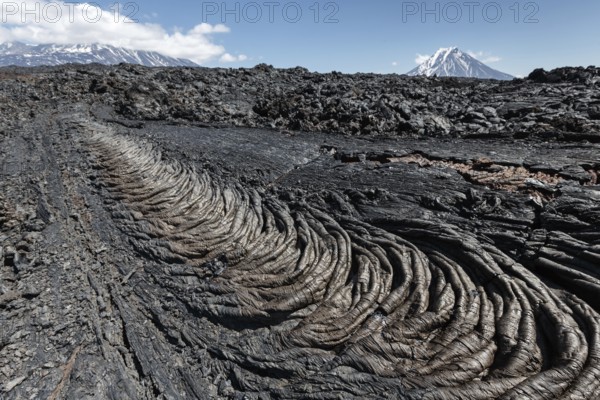Volcanic landscape of Kamchatka Peninsula: beautiful view of lava field volcanic eruption active Plosky Tolbachik Volcano on a clear, sunny weather. Eurasia, Russian Far East, Kamchatka Region, Klyuchevskaya Group of Volcanoes
