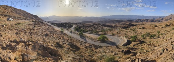 A road winding up a mountain in a great mountain landscape in the Anti-Atlas, Morocco