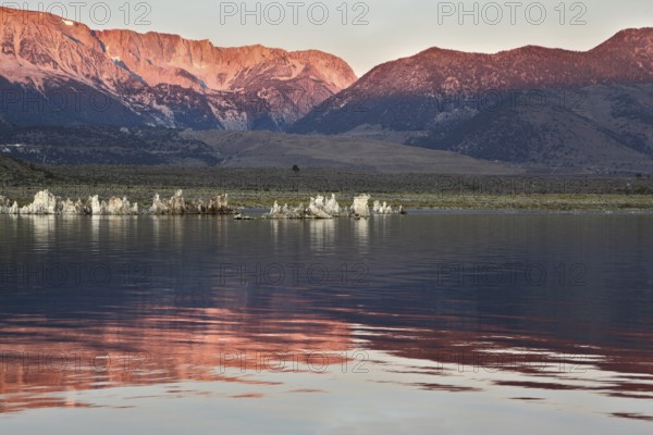 Sunrise at Mono Lake in the crater of an ancient extinct volcano. Shallow lake, a multitude of picturesque reefs Tufa. Magically beautiful sunrise