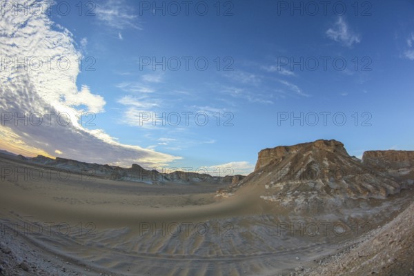 Late afternoon sun casting shadows on rocks in the Libyan desert white desert, Farafra, Egypt