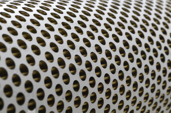 Detail of a tractor oil filter creates an industrial textured background