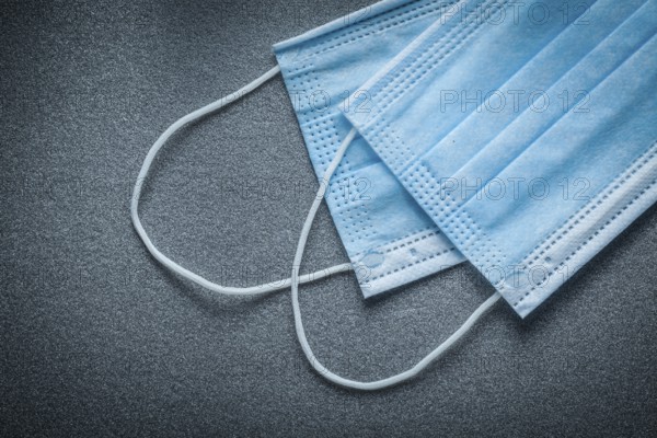 Surgical masks on grey background
