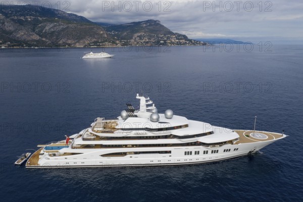 Aerial view 106, 5 metre motor yacht AMADEA, delivered in 2016 by the German shipyard Lürssen Yachts, design Espen Oeino, at anchor off Beaulieu sur Mer near Cap Ferrat, Alpes-Maritimes department, Provence-Alpes-Cote d'Azur region, France, Mediterranean Sea