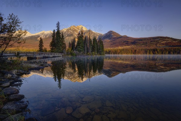 Beautiful autumn landscape scene in mountain in background in Jasper National Park west Canada with birds
