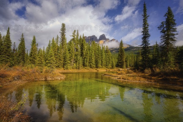 Beautiful autumn landscape scene in lake and mountain in background in west Canada
