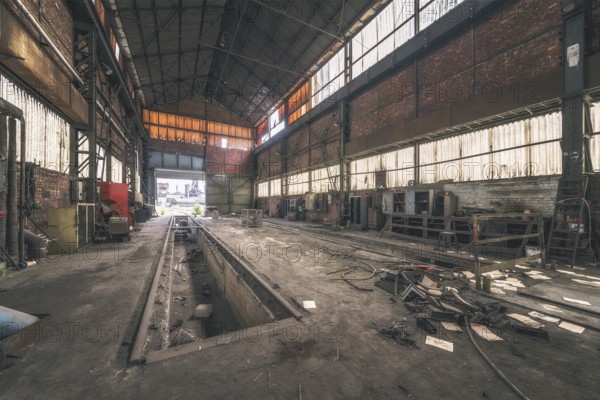 Dark, abandoned industrial hall with metal structures and rubbish on the floor, HF4 steelworks, Lost Place, Dampremy, Charleroi, Province of Hainaut, Belgium