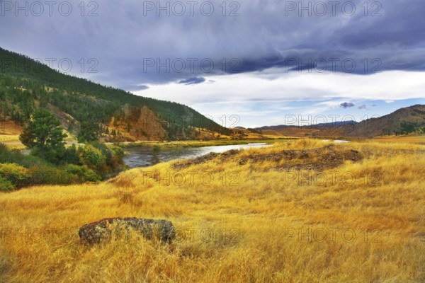 The river Missouri is beautifully bent between brightly yellow meadows
