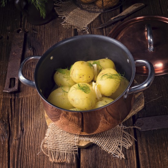 Fresh boiled young potatoes with butter
