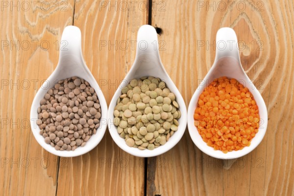 Three kinds of lentil in bowls - red lentil, green lentil and brown lentil, lodz, poland
