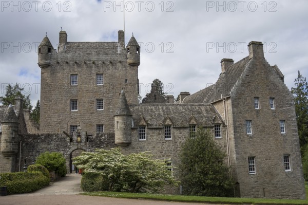 A medieval castle with impressive stone walls and towers, surrounded by trees, inverness, scotland, Great Britain