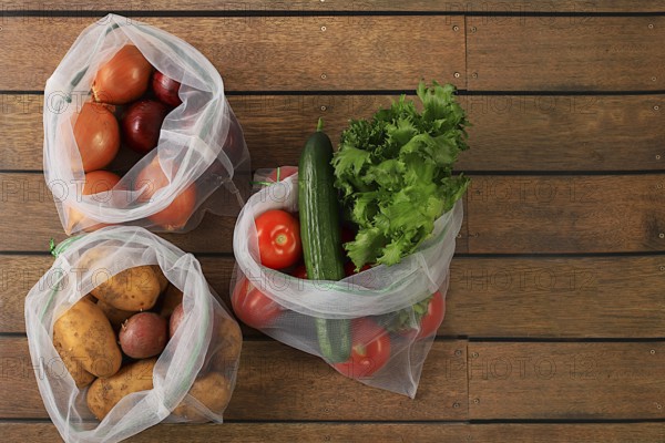 Healthy natural products in an eco bag to boost immunity, healthy lifestyle concept, zero waste. Dietary fruits and vegetables in fabric packaging. Banner for the store. No plastic. Selective focus