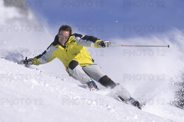 Skiers in action, deep snow, Austria
