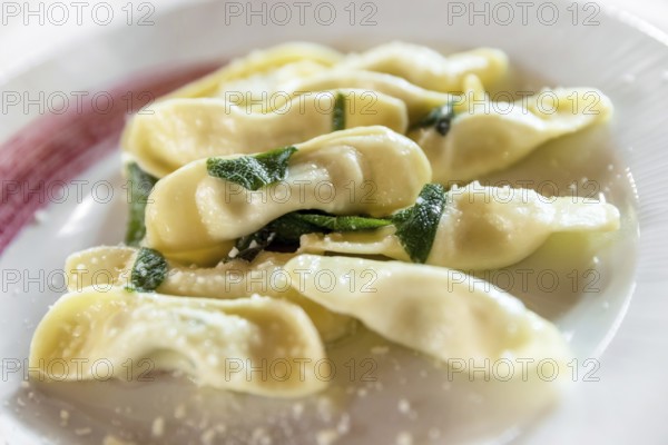 Scarpinocc are typical ravioli from Bergamo, with a characteristic flattened shape. They differ from Casoncelli, typical of the town of Parre, in shape and filling: the latter is lean, but rich and tasty thanks to Grana Padano DOP, breadcrumbs, eggs, milk and spices