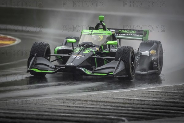 ROMAIN GROSJEAN (77) of Geneva, Switzerland comes through turn 12 (Canada Corner) during a wet practice session for the XPEL Grand Prix at Road America in Elkhart Lake, WI