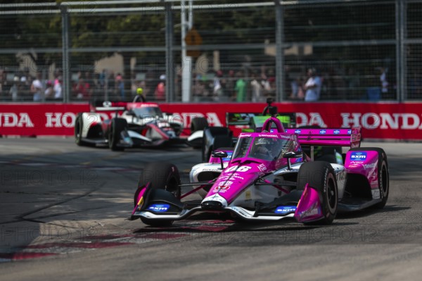 HELIO CASTRONEVES (06) of Sao Paulo, Brazil runs through the streets during the Honda Indy Toronto in Toronto, ON, CAN