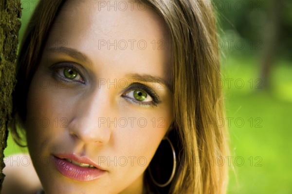 Young beautiful lady relaxing in the park