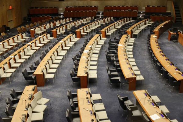 UN Headquarters, East River, Manhattan, An avenue of flags of the member states of the United Nations next to a street, New York City, New York, USA, Large empty conference room with orderly seating arrangement, North America
