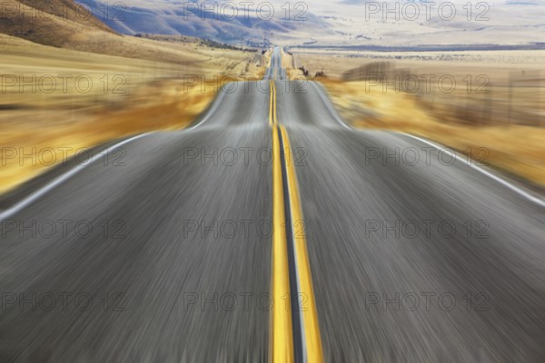 A Mirage on high speed. Magnificent American road and fencings on roadsides from snow drifts
