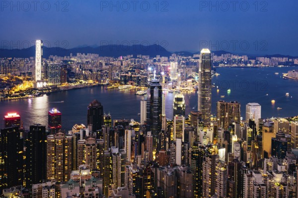 HONG KONG, CHINA - SEPTEMBER 29, 2024: Iconic view around sunset from Lugard Rd Lookout which overlooks Hong Kong Island and Kowloon in Hong Kong, China, Hong Kong, China