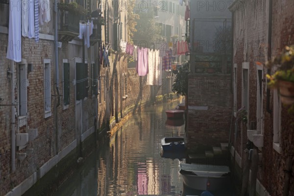 Drying clothes on the rope across venetian channel