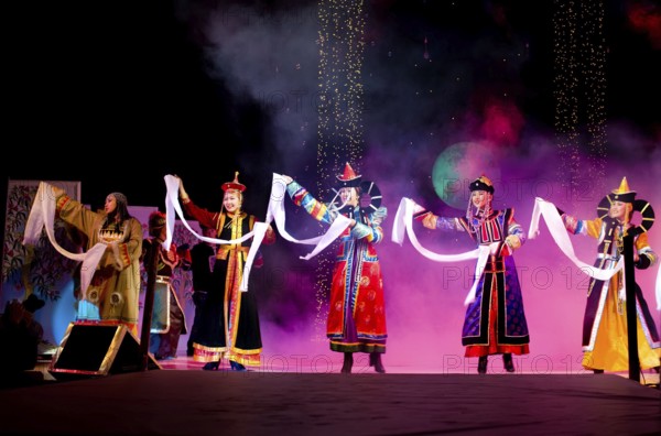 ULAN-UDE, RUSSIA - OCTOBER 29: Asian models demonstrate a dresses in ethnic style at the international asian fashion festival on October, 29, 2009 in Ulan-Ude, Buryatia, Russia