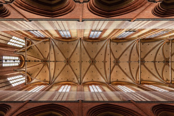 Wismar, Germany, August 2, 2019: Church of St. Nicholas. Interior view directly below the vaults of the main nave