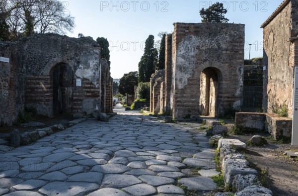 POMPEII, ITALY, MAY 04, 2022, A beautiful typical cobbled street in the ancient city of Pompeii, Southern Italy
