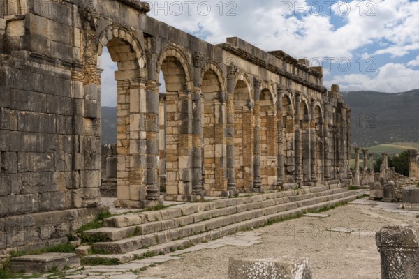 Iconic ruins of the forum in Volubilis, an old ancient Roman city in Morocco, North Africa