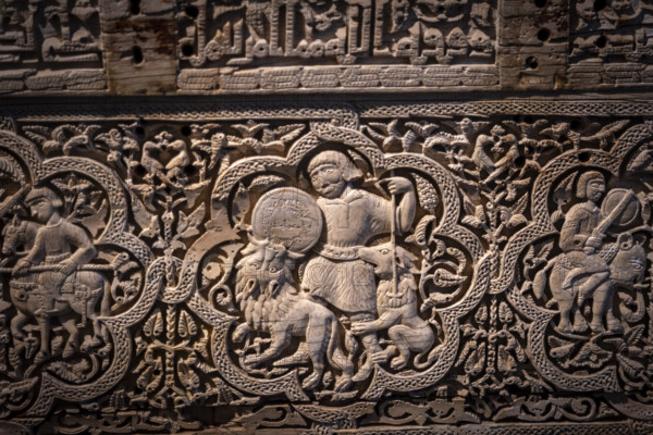A man on foot, armed with a spear and buckler, rained down against two lionsn Spanish-Arab chest of the Leire monastery, 1004 after Christ. manufactured in the Madinat Al-Zahira workshop
