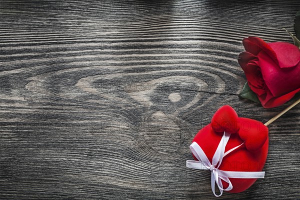 Red heart rose on wooden board celebrations concept