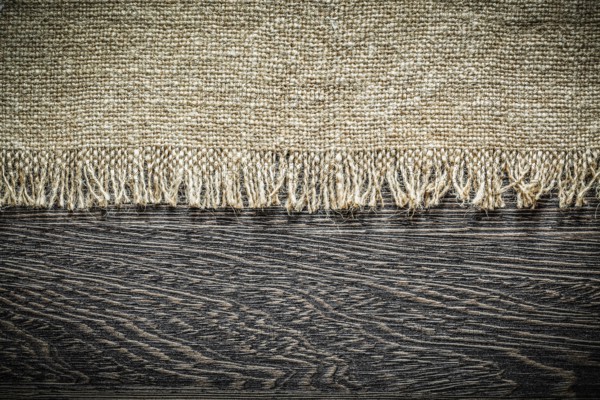 Vintage hessian on wooden board