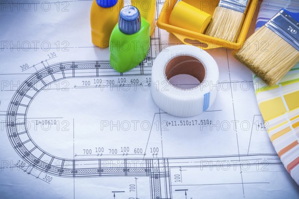 Construction drawing with paint brush roller tray bottles duct tape and color sampler maintenance concept