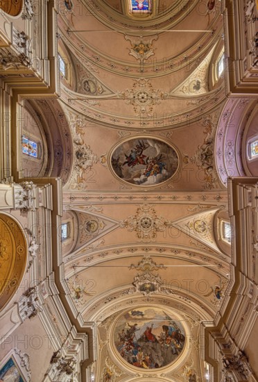 Stucco ceiling with frescoes in the catholic church of Santo Stefano