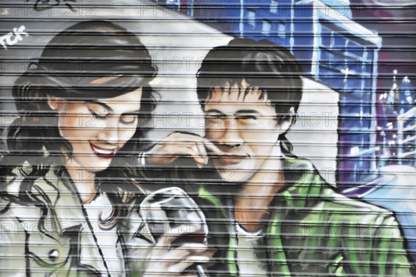 Madrid, Spain, Europe, Colourful mural of a laughing man and a woman drinking wine