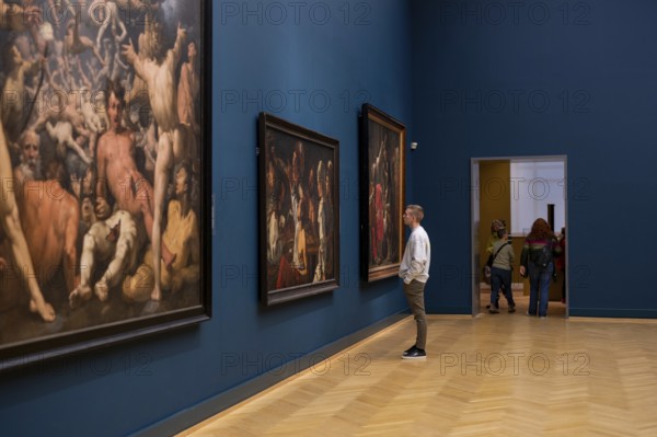Copenhagen, Denmark, January 20, 2024: A visitor looking at paintings inside the National Gallery of Denmark