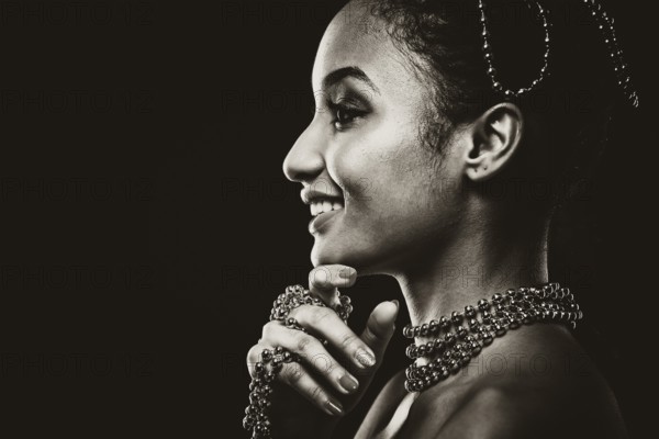 Upscale Indian woman wearing chain jewellery and beautiful makeup. Black and white photo. Mysterious beauty expressions, Toronto, Canada