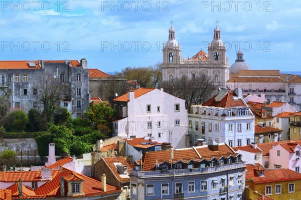 Lisbon, Portugal panoramic aerial view with colorful houses and Estrela Basilica cathedral towers