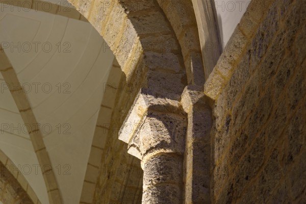 Detail of romanesque capital and column in church